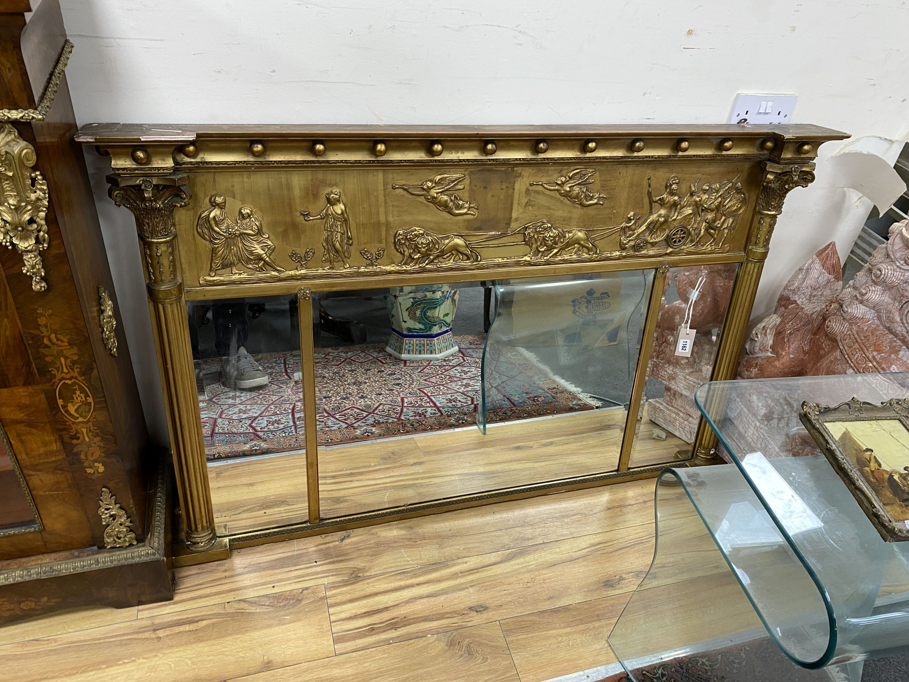 A Regency giltwood and composition triple plate overmantel mirror, width 141cm, height 89cm